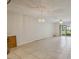 Bright living area with tiled flooring and sliding glass doors to the outside at 122 N Kings Ave # 101, Brandon, FL 33510