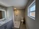 Modern bathroom features a spacious walk-in shower, granite countertop, and updated fixtures at 12801 College Hill Dr, Hudson, FL 34667