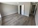 This bedroom has new hardwood floors with a walk in closet and attached bathroom at 12801 College Hill Dr, Hudson, FL 34667