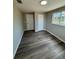 This bedroom has new hardwood floors, a closet, and new windows at 12801 College Hill Dr, Hudson, FL 34667