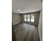 This bedroom has new hardwood floors and new windows at 12801 College Hill Dr, Hudson, FL 34667