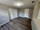 This bedroom has new hardwood floors and sliding door closet at 12801 College Hill Dr, Hudson, FL 34667