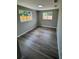 This bedroom has new hardwood floors and new windows at 12801 College Hill Dr, Hudson, FL 34667