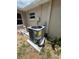Exterior view of the back of the house featuring the HVAC system at 12801 College Hill Dr, Hudson, FL 34667