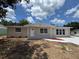 Attractive single-story home with well-manicured lawn and welcoming curb appeal at 12801 College Hill Dr, Hudson, FL 34667