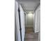 This hallway has new hardwood floors and a white door at 12801 College Hill Dr, Hudson, FL 34667