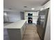 Updated kitchen featuring stainless steel appliances and center island at 12801 College Hill Dr, Hudson, FL 34667