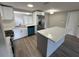 Modern kitchen with stainless steel appliances, quartz countertops and ample cabinet space at 12801 College Hill Dr, Hudson, FL 34667
