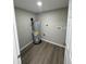 This is the home's utility room with new hardwood floors at 12801 College Hill Dr, Hudson, FL 34667