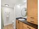 Clean bathroom with granite counters, wood cabinets, and ample lighting in this well maintained space at 13512 Palmwood Ln # 13512, Tampa, FL 33618