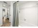 Bright bathroom featuring tile flooring, a shower, and linen closet access at 13512 Palmwood Ln # 13512, Tampa, FL 33618