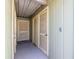 A light green exterior with white doors is an entrance to a home at 13512 Palmwood Ln # 13512, Tampa, FL 33618
