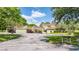 Well-kept condo complex with carports, mature trees, and ample parking space at 13512 Palmwood Ln # 13512, Tampa, FL 33618