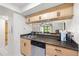 Kitchen with stainless steel appliances, light cabinetry, dark countertop space, providing modern conveniences at 13512 Palmwood Ln # 13512, Tampa, FL 33618