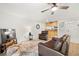 Comfortable living room with leather furniture, ceiling fan, and modern decor for relaxing and entertaining guests at 13512 Palmwood Ln # 13512, Tampa, FL 33618