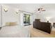 Inviting bedroom with ample natural light, wood-look floors, and sliding door access at 13512 Palmwood Ln # 13512, Tampa, FL 33618