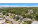 Scenic aerial view of the property and the neighborhood with trees, streets, and skyline at 14199 82Nd Avenue, Seminole, FL 33776