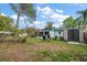 Spacious backyard featuring a shed and outdoor seating area, perfect for relaxation at 14199 82Nd Avenue, Seminole, FL 33776
