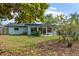 A spacious backyard featuring a charming pergola and lovely landscaping for serene outdoor living at 14199 82Nd Avenue, Seminole, FL 33776