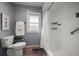 Well-lit bathroom featuring a shower with a white curtain, a toilet, and a small window offering natural light at 14199 82Nd Avenue, Seminole, FL 33776