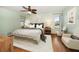 Bedroom with a ceiling fan, neutral color scheme, and windows providing natural light at 14199 82Nd Avenue, Seminole, FL 33776