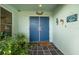 Charming front entrance with double doors, decorative elements, and a welcome mat at 14199 82Nd Avenue, Seminole, FL 33776