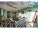 Inviting patio space with outdoor seating, decorative elements, and sliding glass doors leading to the interior at 14199 82Nd Avenue, Seminole, FL 33776