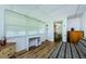 Cozy bedroom with wood-look floors, closet, and natural lighting at 144 Melody Ln, Tarpon Springs, FL 34689