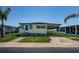 Charming single-story home with carport and well-maintained front yard at 144 Melody Ln, Tarpon Springs, FL 34689