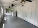 Bright Florida room offers ample natural light, washer, and ceiling fans for a relaxing indoor space at 1902 W Aileen St, Tampa, FL 33607