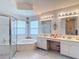 Ensuite bathroom features garden tub, glass shower, and double sink vanity at 2018 E Del Webb Blvd, Sun City Center, FL 33573