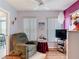 Relaxing living room with a cozy recliner and entertainment center at 2018 E Del Webb Blvd, Sun City Center, FL 33573