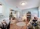 Cozy living room showcasing floral furniture, wood floors, and soft, natural light, perfect for relaxation at 2018 E Del Webb Blvd, Sun City Center, FL 33573