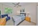 Comfortable bedroom with ceiling fan, natural light and neutral decor at 2220 Nantucket Dr # 43, Sun City Center, FL 33573