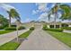 Well-maintained one-story home exterior with a driveway and manicured landscaping at 2220 Nantucket Dr # 43, Sun City Center, FL 33573