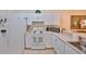 Efficient kitchen with appliances and ample counter space, perfect for culinary creations and convenience at 2220 Nantucket Dr # 43, Sun City Center, FL 33573