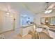 Inviting living room and dining area with neutral tones and open layout to the kitchen at 2220 Nantucket Dr # 43, Sun City Center, FL 33573
