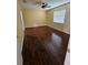 Bedroom with hardwood floors, a fan, and a window at 2704 E Montague E Ct, Clearwater, FL 33761