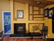 Living room fireplace with tile hearth, wooden display shelving, and interior access at 2704 E Montague E Ct, Clearwater, FL 33761