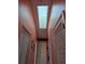 Hallway with a skylight above, three closet doors and one passage door at 2704 E Montague E Ct, Clearwater, FL 33761