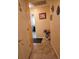 Entryway hallway featuring a vase of flowers, decorative masks, and tiled flooring at 2704 E Montague E Ct, Clearwater, FL 33761