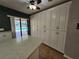 Kitchen features ample storage with white cabinets and backyard view at 2704 E Montague E Ct, Clearwater, FL 33761
