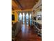 Living room with a view of the pool, sliding glass doors, hardwood floors, and a breakfast bar at 2704 E Montague E Ct, Clearwater, FL 33761
