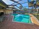 Beautifully maintained pool area with screened enclosure and ample space at 2704 E Montague E Ct, Clearwater, FL 33761
