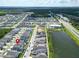 An aerial shot of modern community, conveniently located near a highway, ponds, and commercial area at 28847 Orange Berry Dr, Wesley Chapel, FL 33543