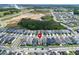 An expansive community featuring manicured lawns and modern homes near a highway and recreational areas at 28847 Orange Berry Dr, Wesley Chapel, FL 33543