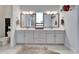 Bright bathroom featuring double vanity and modern fixtures at 28847 Orange Berry Dr, Wesley Chapel, FL 33543