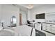 Bright bedroom with a comfortable bed, desk and TV at 28847 Orange Berry Dr, Wesley Chapel, FL 33543