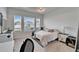 Bright bedroom with large windows and neutral decor at 28847 Orange Berry Dr, Wesley Chapel, FL 33543