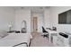 Bright bedroom with a comfortable bed, desk and TV at 28847 Orange Berry Dr, Wesley Chapel, FL 33543